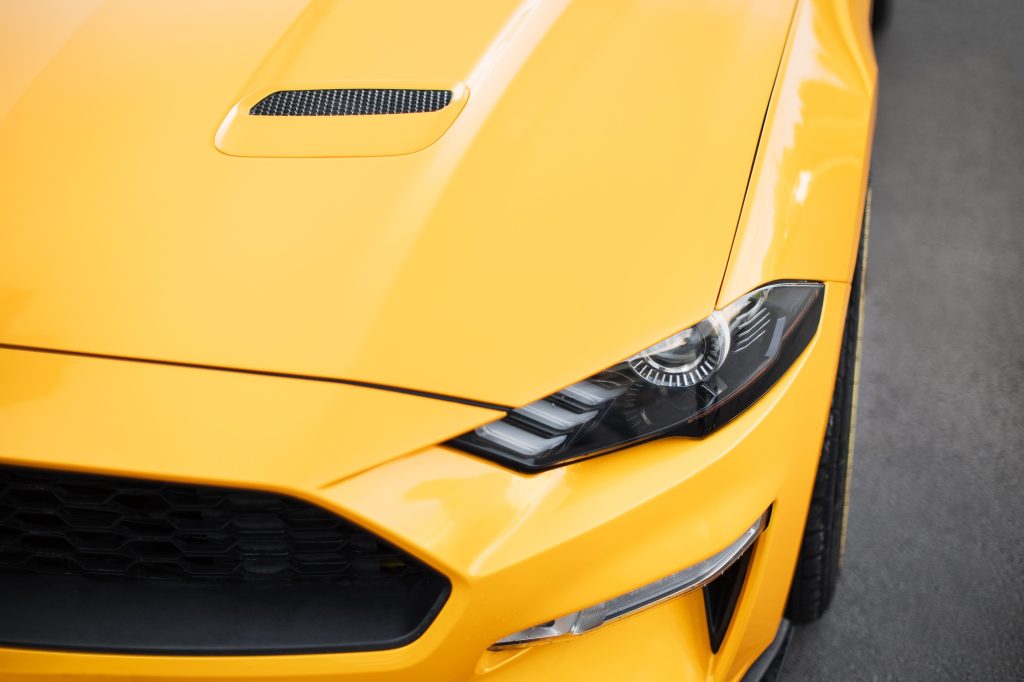 Front light of yellow sport car